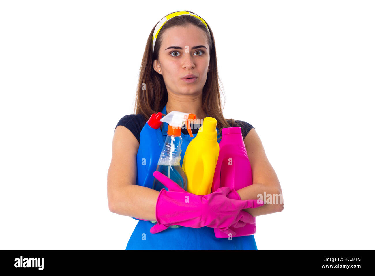 Woman in apron holding a detergents Stock Photo - Alamy