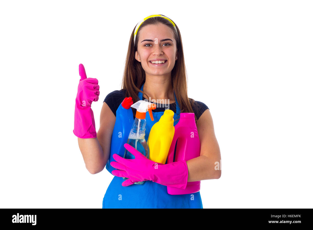 Woman in apron holding a detergents Stock Photo - Alamy