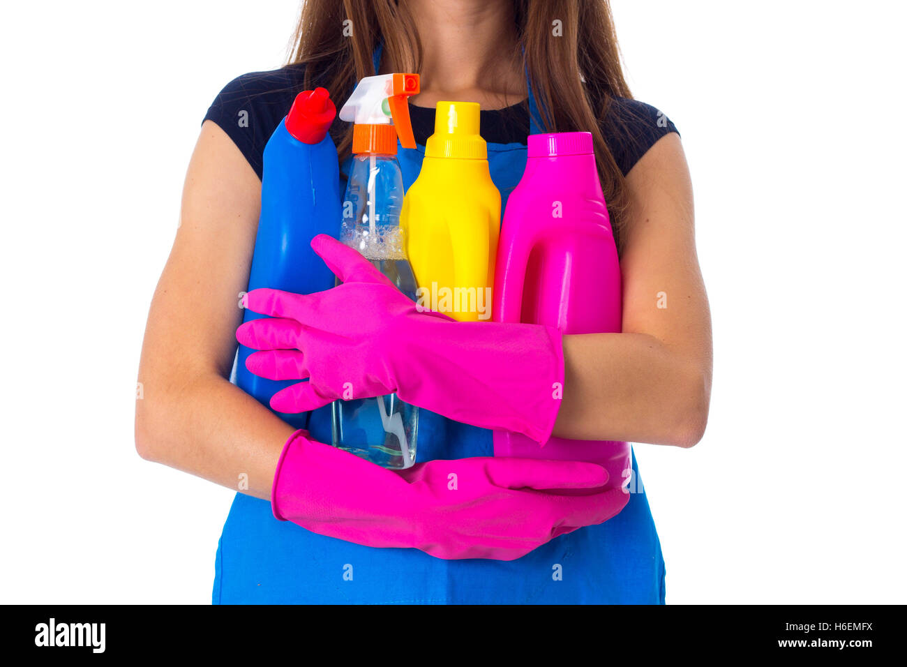 Woman in apron holding a detergents Stock Photo - Alamy