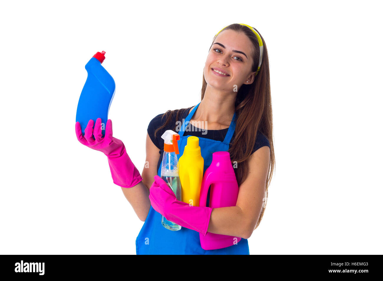 Woman in apron holding a detergents Stock Photo - Alamy
