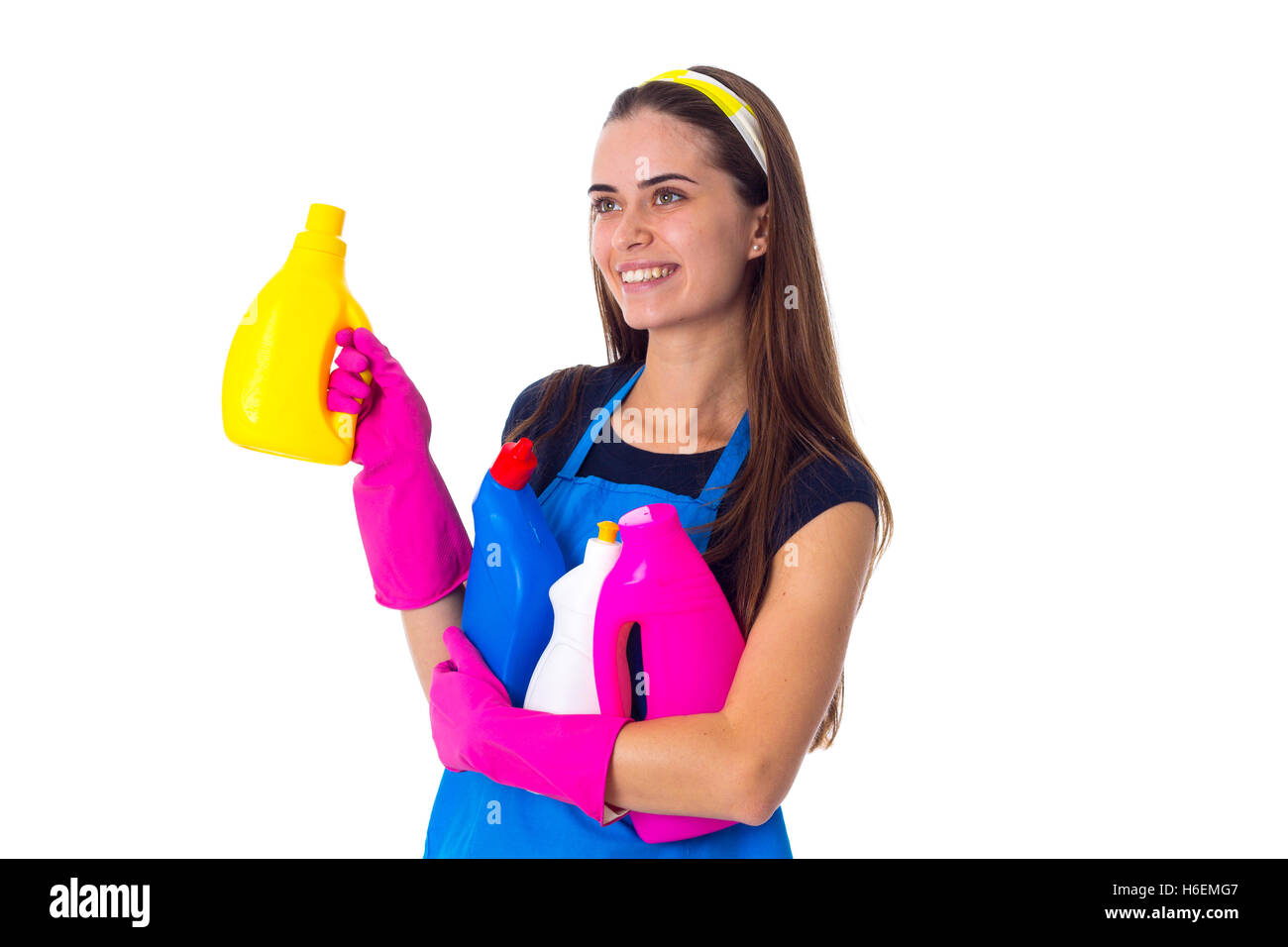 Woman in apron holding a detergents Stock Photo - Alamy