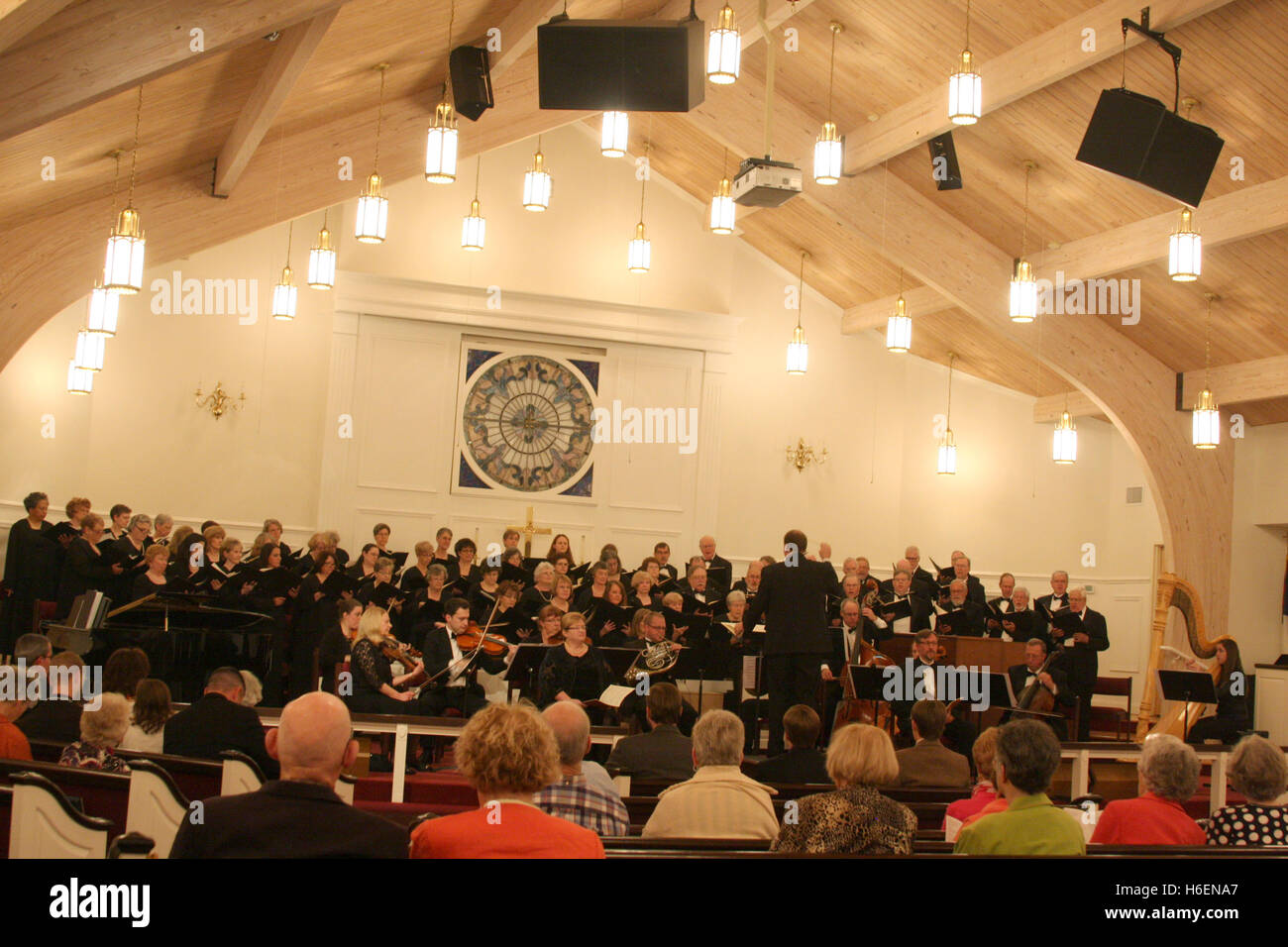 Choir and orchestra having a public performance in church Stock Photo