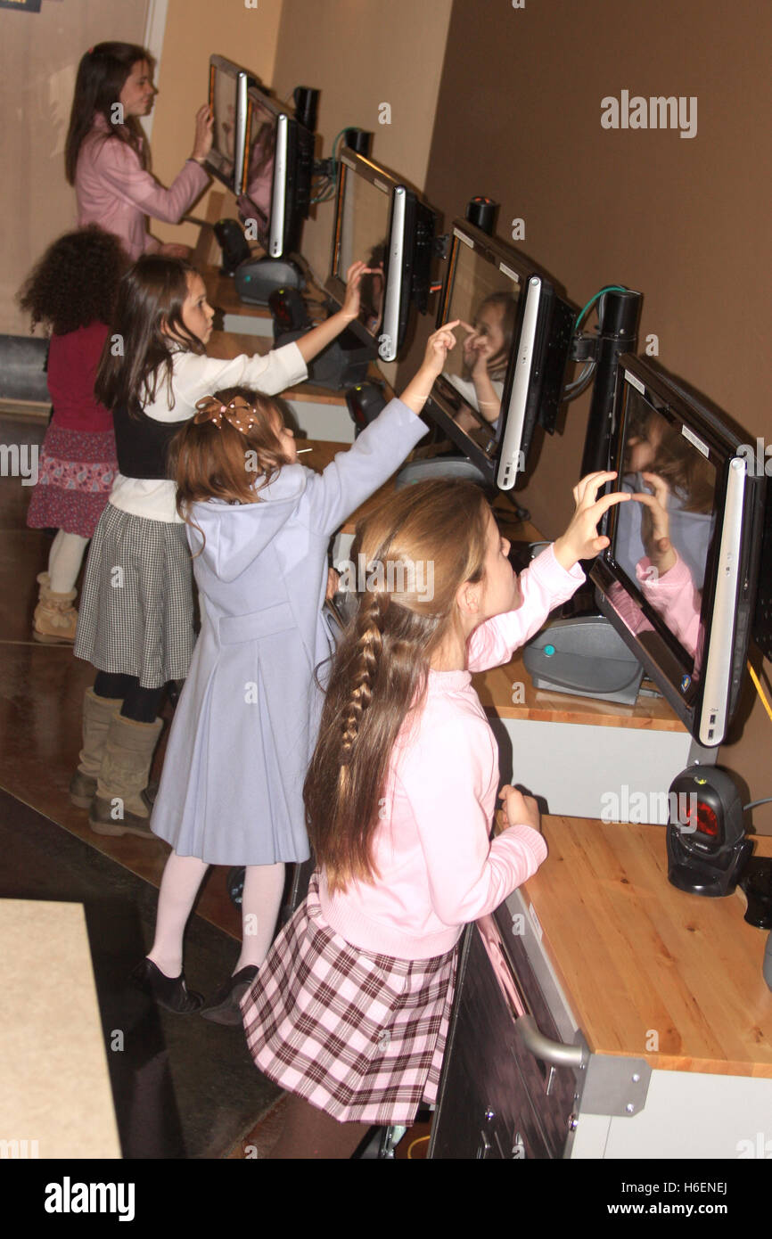 5 Girls Using Computer Five girls working on touch screen computers Stock Photo - Alamy