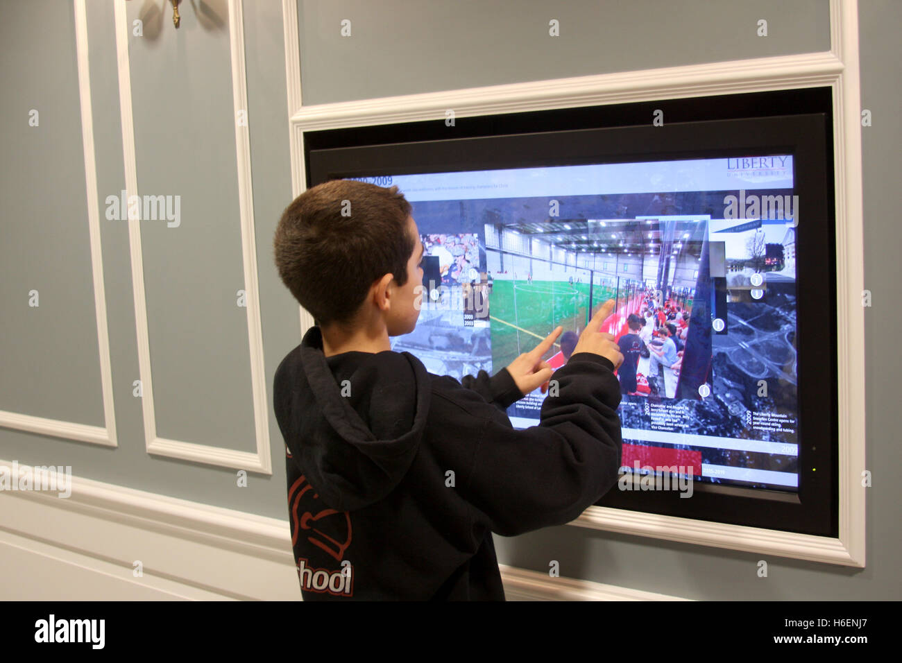 Large Touch Screen >> Young Boy Playing On A Large Touch Screen Display Inside Large Touch Screen >> Young Boy Playing On A Large Touch Screen Display Inside