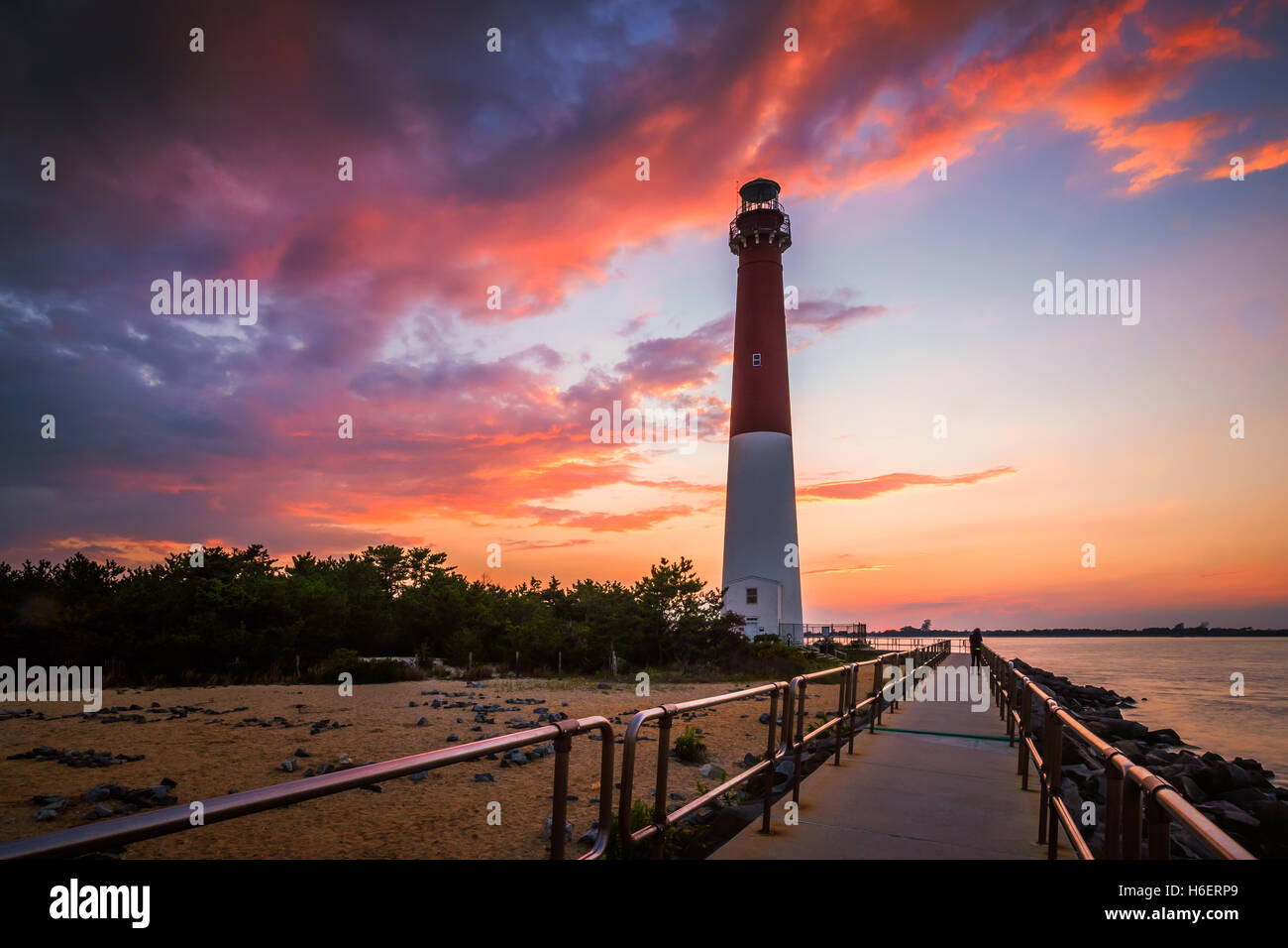 Barnegat Lighthouse or Barnegat Light, colloquially known as "Old Barney" at sunset Stock Photo