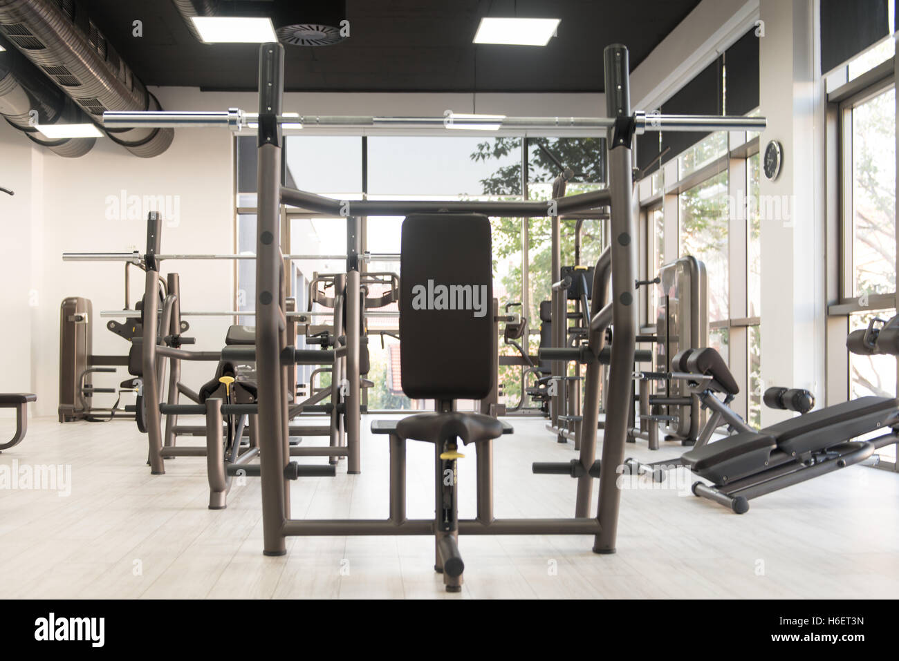 Modern Gym Room Fitness Center With Equipment And Machines Stock Photo ...