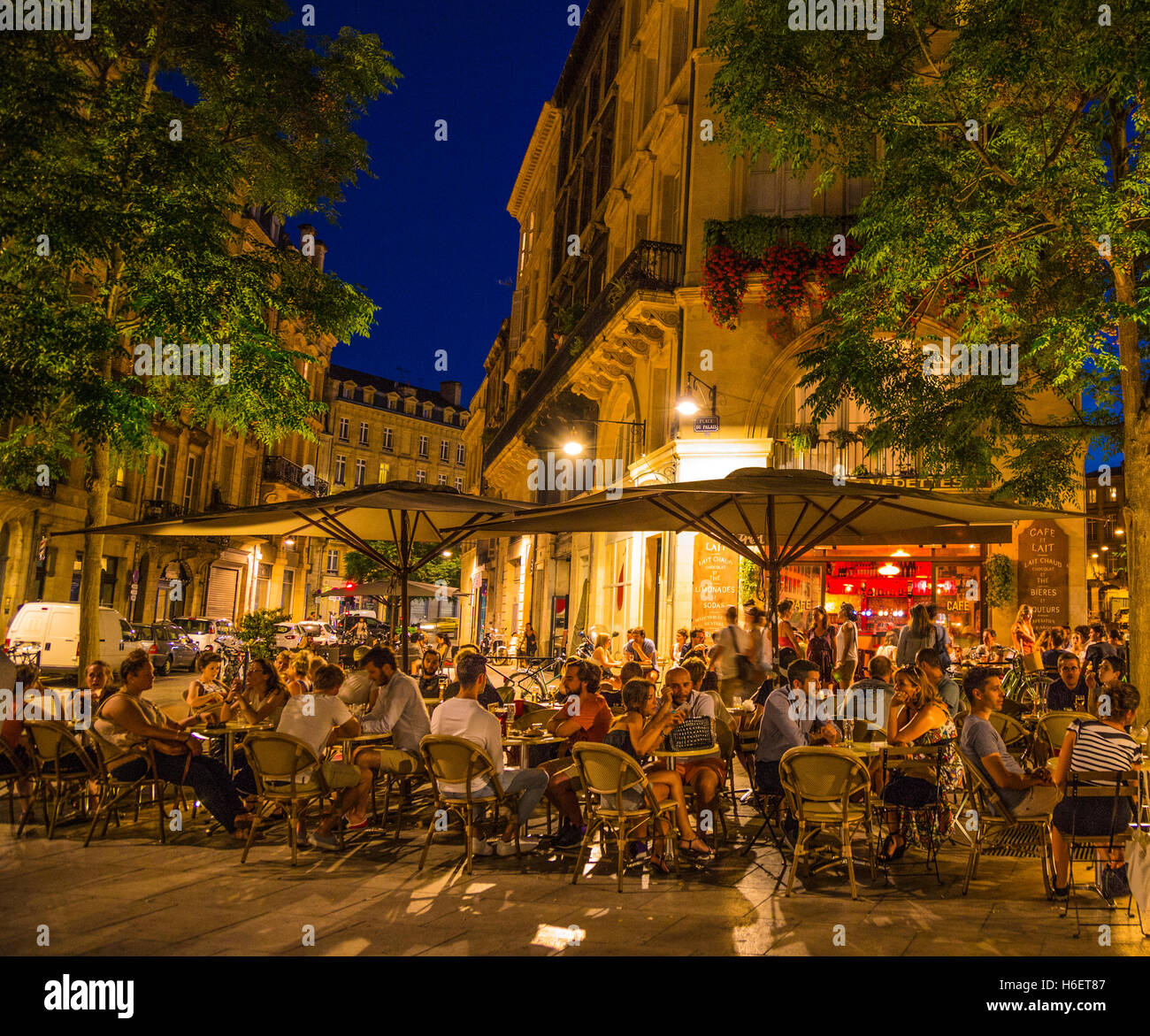 A street corner cafe in Bordeaux at night Stock Photo