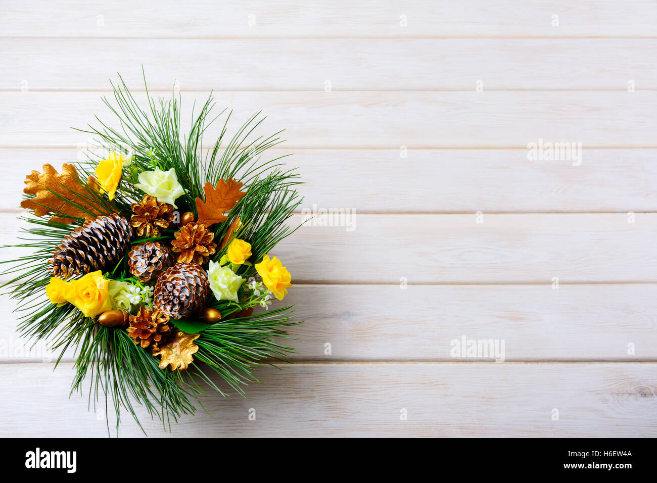 Christmas background with holiday golden cones decorated centerpiece. Christmas decoration with golden decor. Christmas party ba Stock Photo