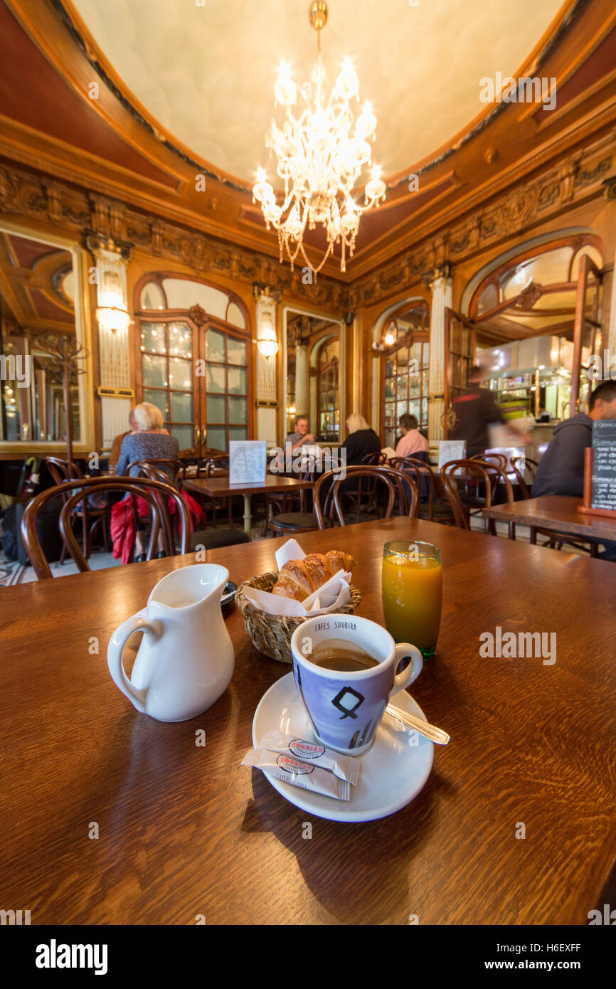 Continental breakfast in classic French cafe croissant and coffee Stock Photo
