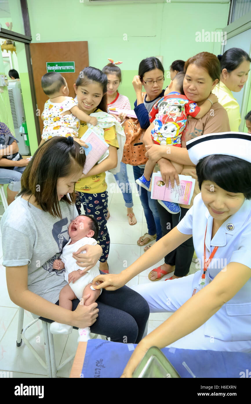 CHIANG MAI, Thailand - August 7, 2016:Children receiving vaccine at out side of the thigh.Children vaccine. CHIANG MAI, Thailand Stock Photo