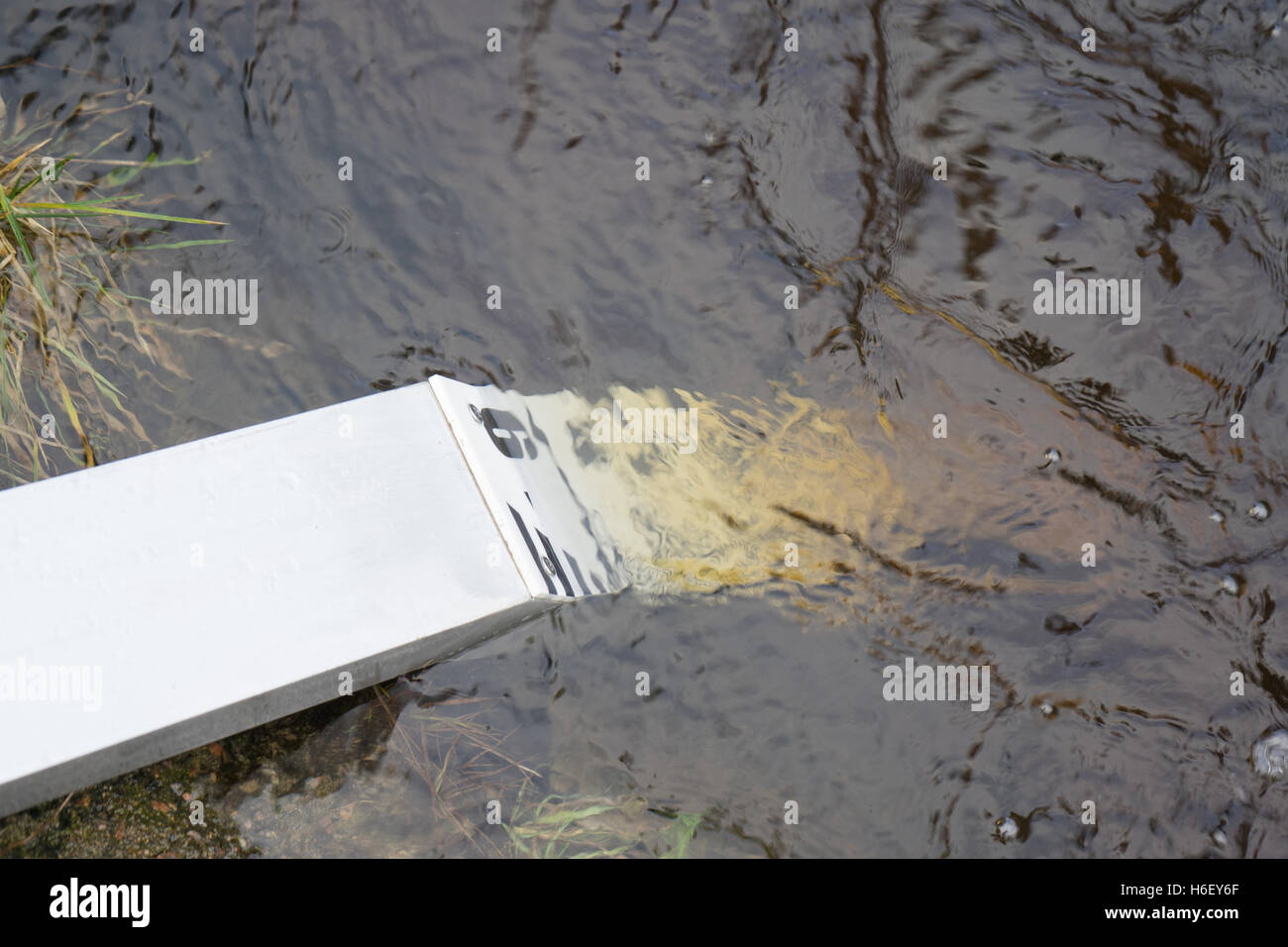 Water height gauge in the river, showing 9 on the scale, very high