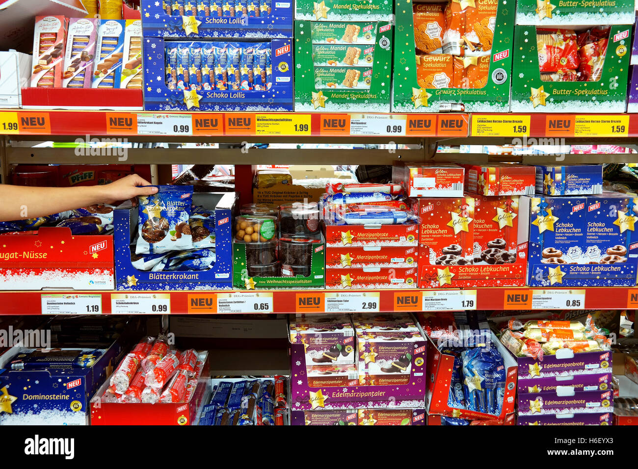 Shelves with Christmas cookies and chocolates in a German Norma discount supermarket. Stock Photo