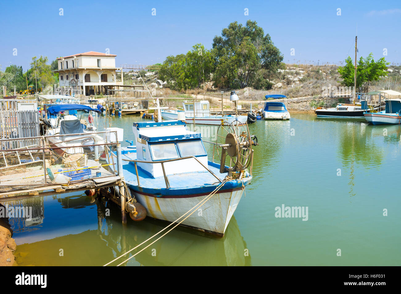 Walking along the river it's easy to find many old boats, moored next to the banks, Liopetri, Cyprus. Stock Photo
