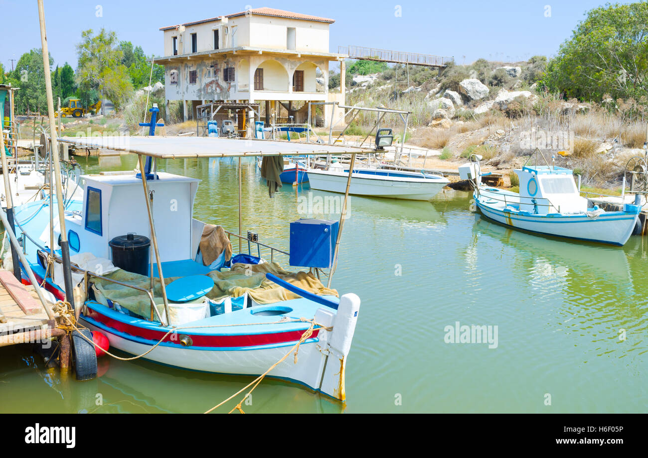 Liopetri is the small fishing village with many old boats in the narrow river, Cyprus. Stock Photo