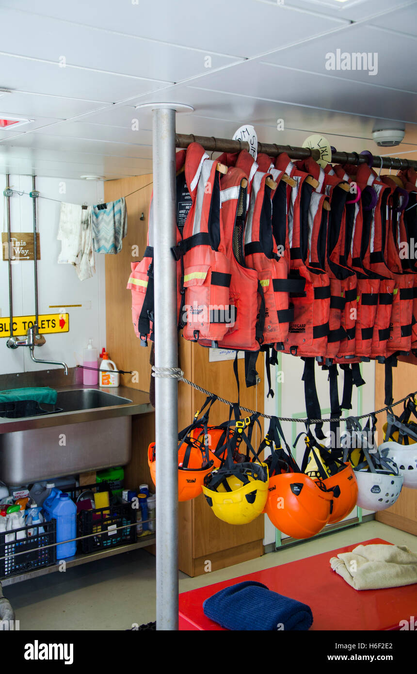 Room with life vests and helmets, Greenpeace new Rainbow Warrior III Vessel moored in port of Malaga, Andalusia, Spain. Stock Photo