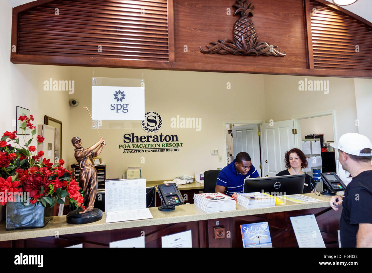 Florida,South,St. Saint Lucie,Sheraton PGA Vacation Resort,lobby,front desk check in reception reservation reservations register,reservations,Black Bl Stock Photo