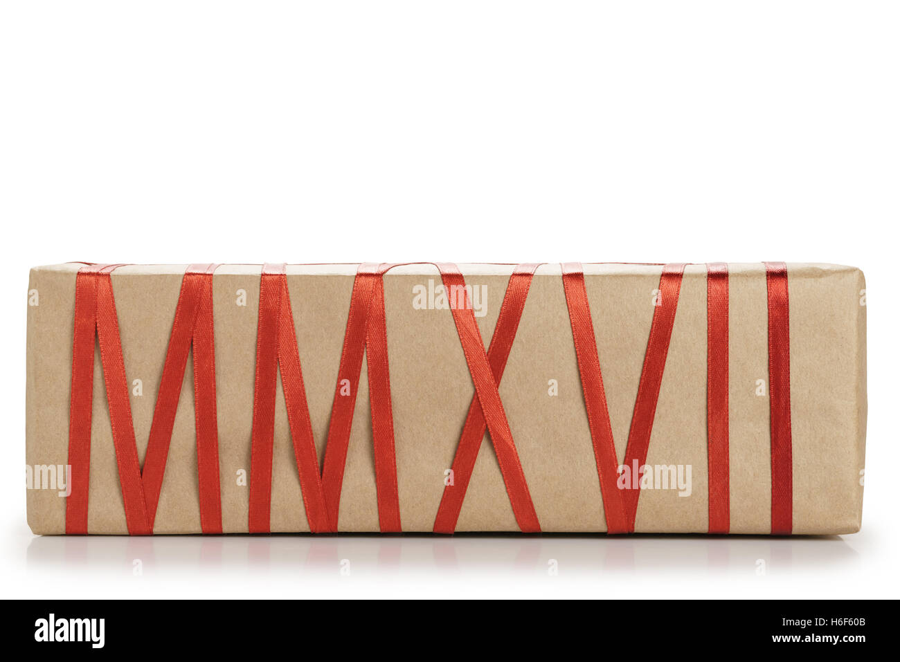 gift box from craft paper with red ribbon forming text MMXVII Stock Photo