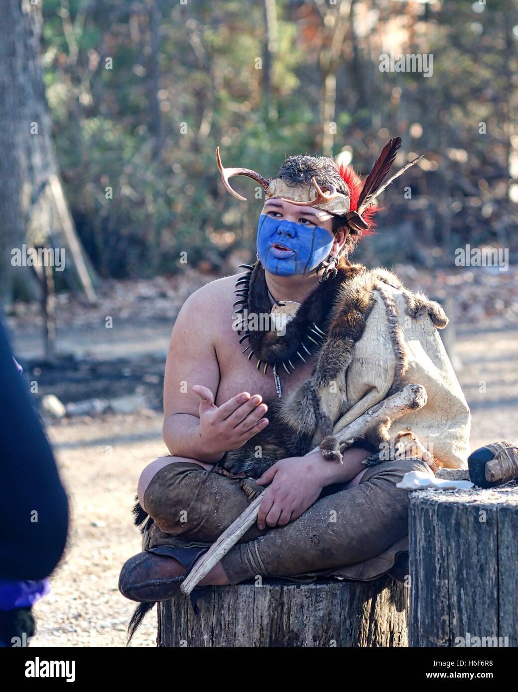 A Native American interpreter educates tourists at the Jamestowne Settlement adjacent to the actual Jamestown historic site. Stock Photo