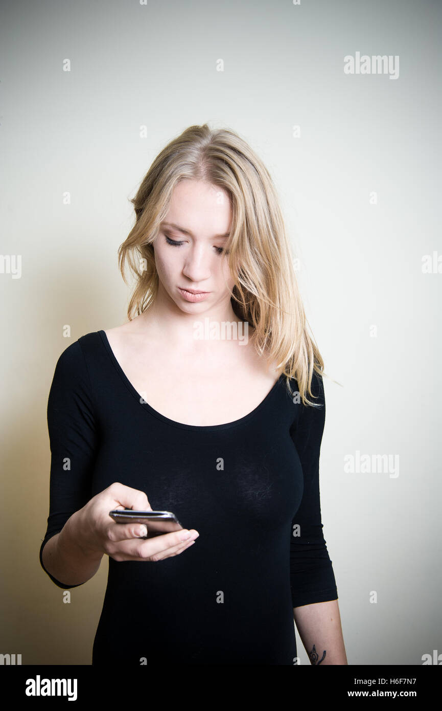 Young blonde woman, thoughtful and looking on side copy space on white background Stock Photo