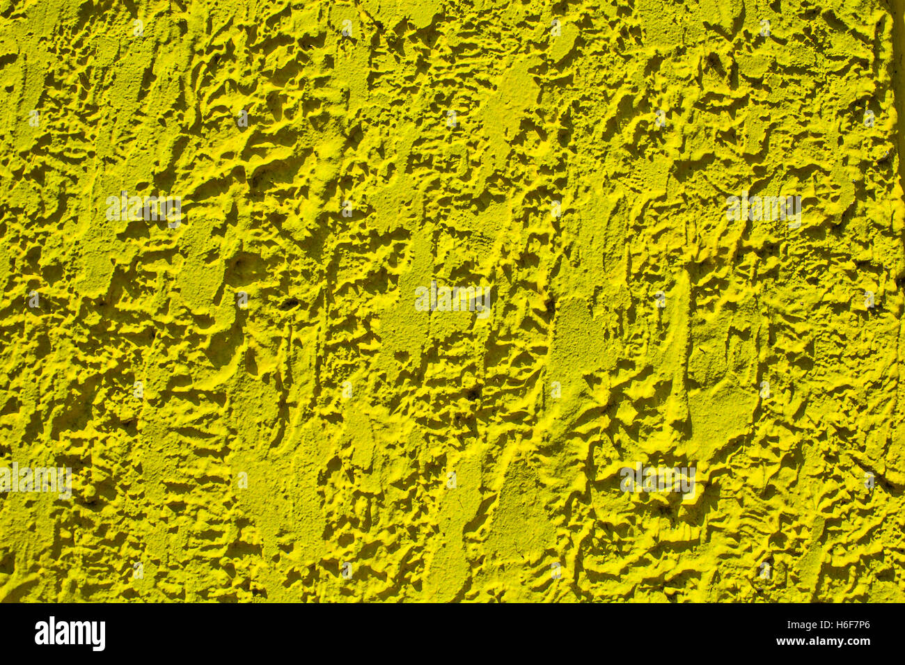 Yellow plastered wall with rough uneven structure Stock Photo Alamy