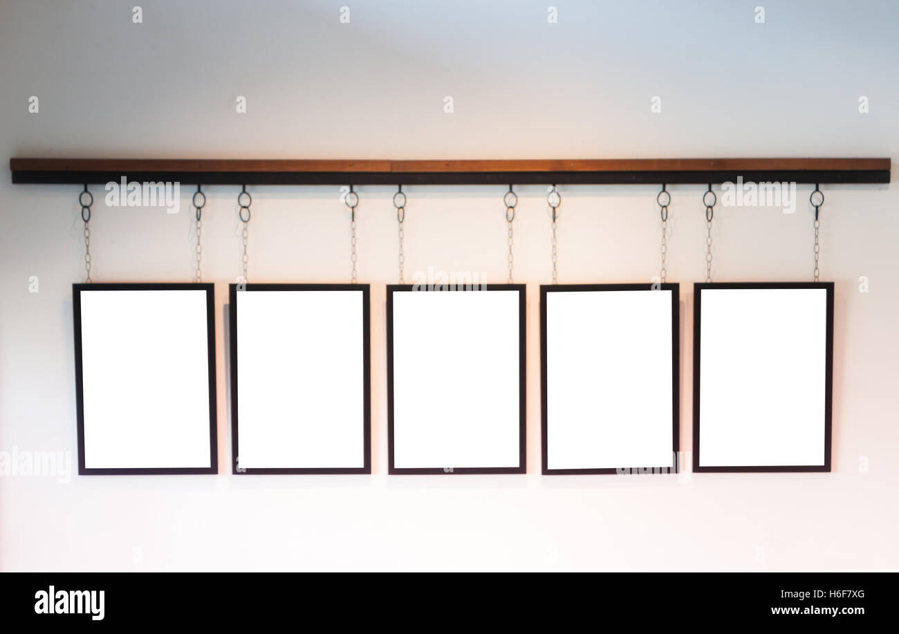 Blank boards hanging on white wall background, stock photo Stock Photo