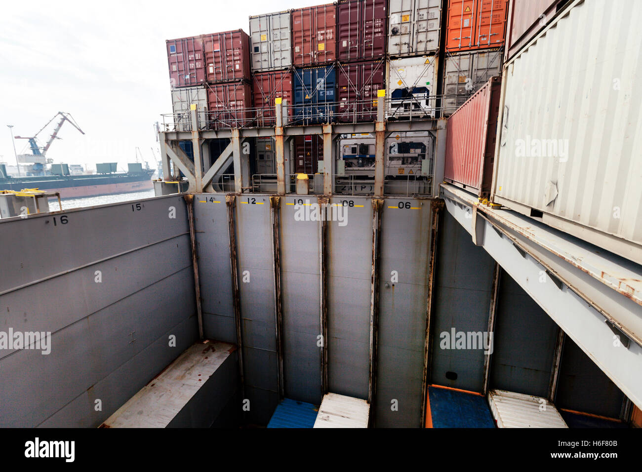 View of a freighter ship's storage compartment, half full with