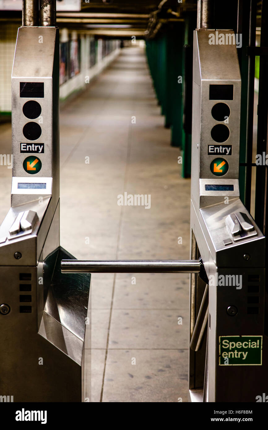 Turnstiles (baffle gates) in a New-York subway station. Stock Photo