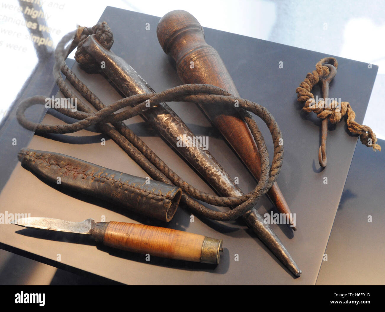 Work on the sailing ships. Maintenance work. Tools: sailmarker's bench hook, marlinspike, pricker and knife with scabbard. Norwegian Maritime Museum. Oslo. Norway. Stock Photo