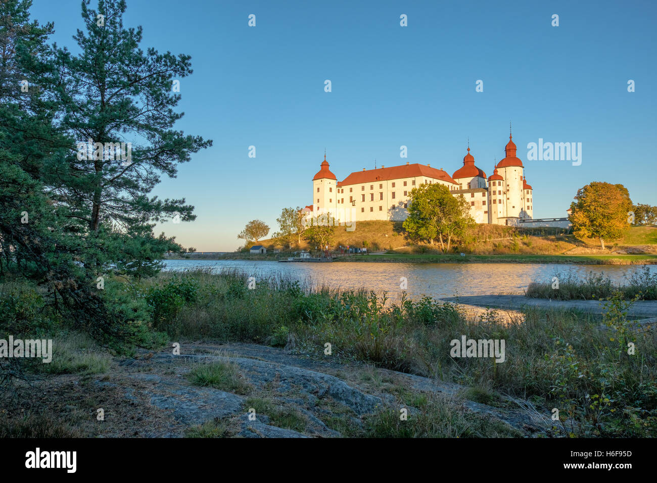 Autumn sunset at Lake Vänern and Läckö Castle Stock Photo - Alamy