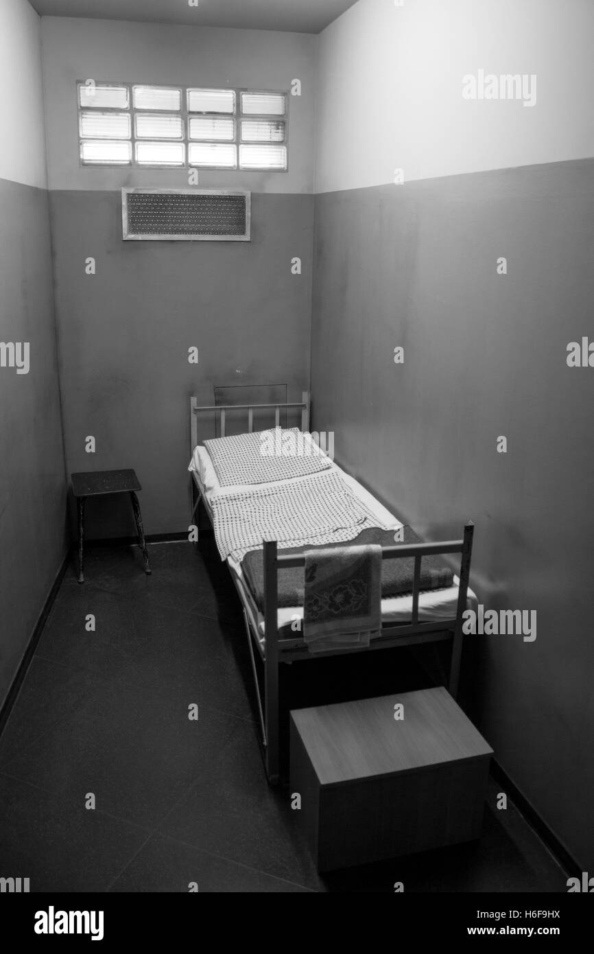 Stasi prison cell reconstruction with bed and table DDR Museum Berlin GErmany Stock Photo