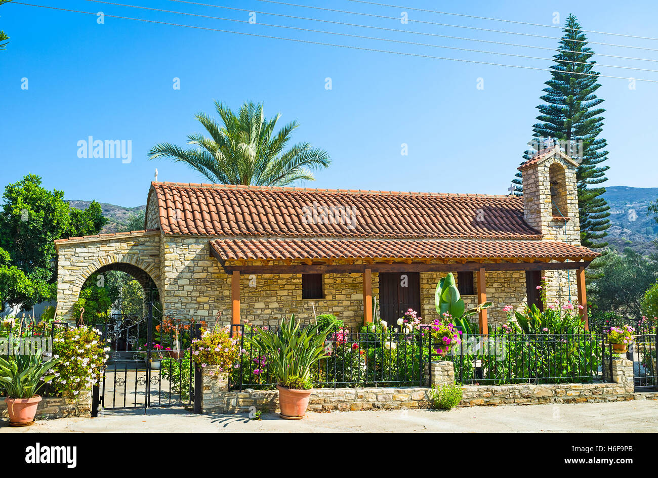 The stone Church of St Minas Monastery, surrounded by the nice garden, Vavla, Cyprus Stock Photo