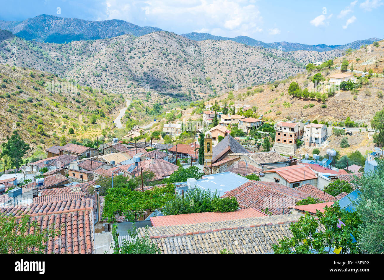 The tiled roofs of the old mountain village with the Troodos mountains