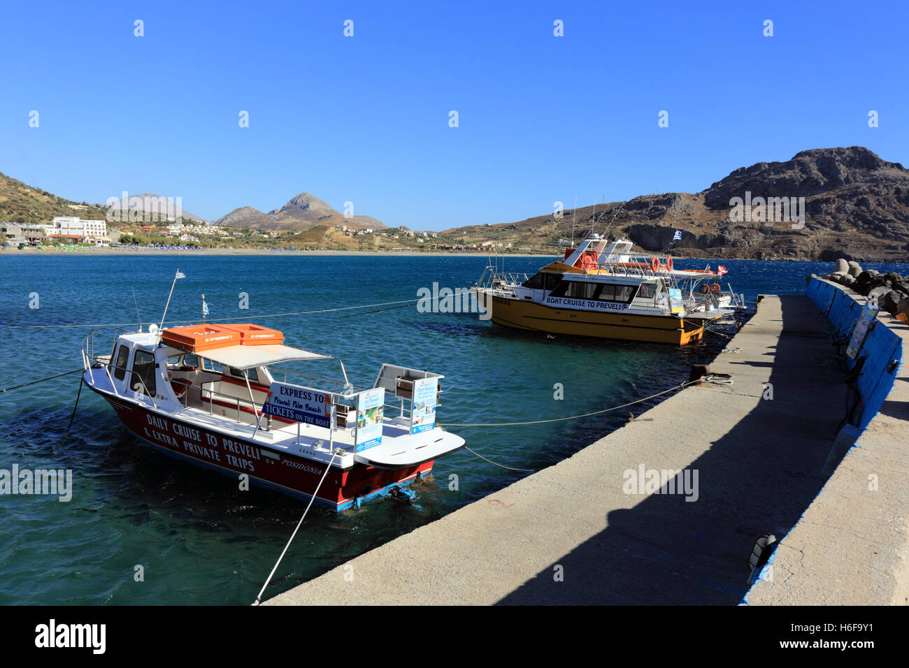 Tour boats offering trips to nearby Preveli beach tied up at the quay in Plakias, south Crete, Greece Stock Photo