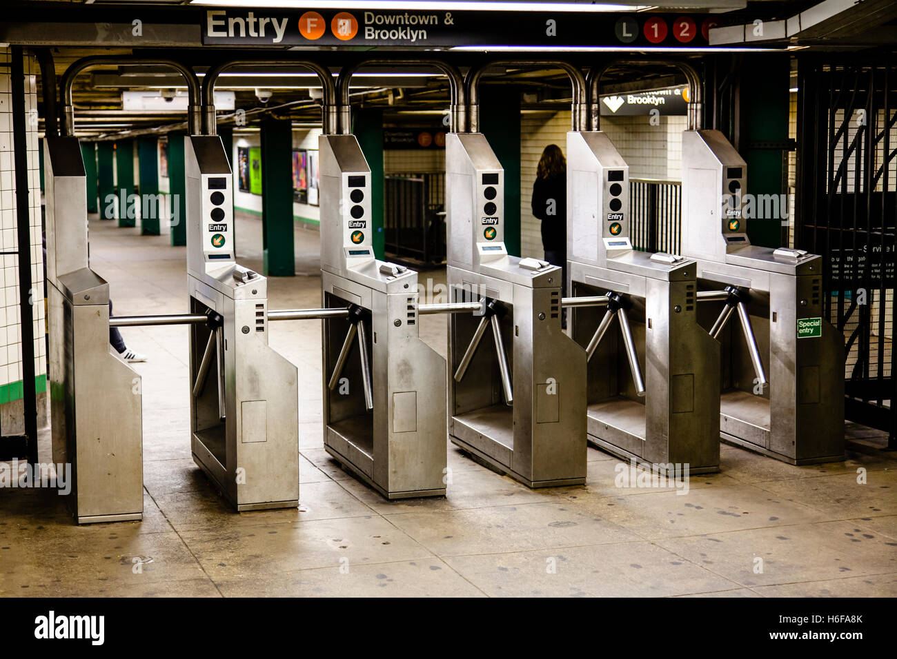 Turnstiles (baffle gates) in a New-York subway station. Stock Photo