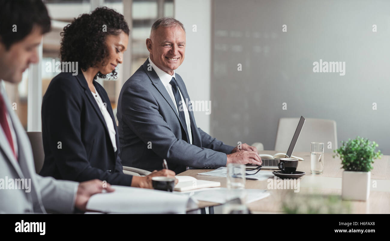 Leading his business team with positivity Stock Photo
