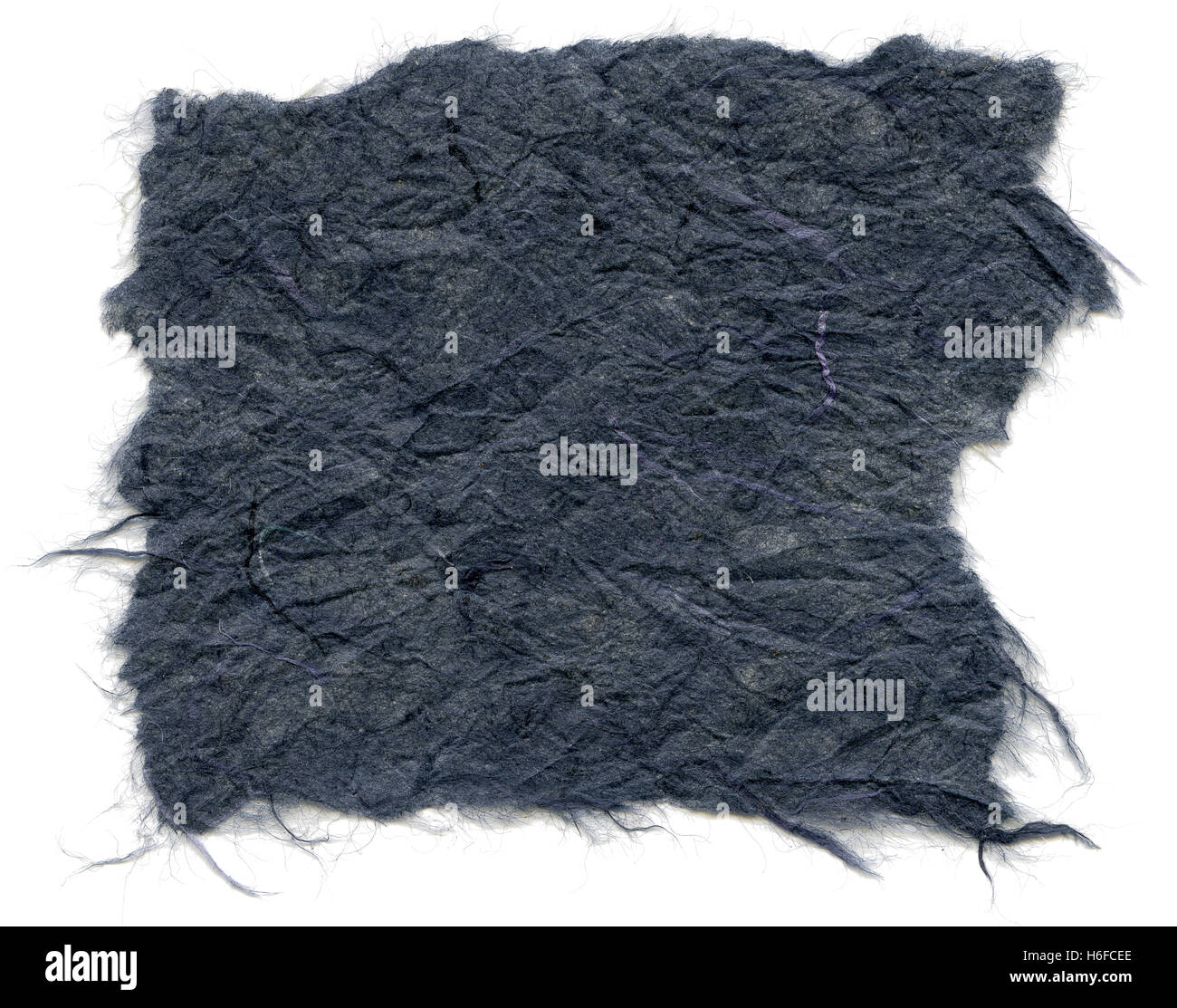 Texture of navy blue rice paper with torn edges. Isolated on white background. Scanned at 2400dpi using a professional scanner. Stock Photo