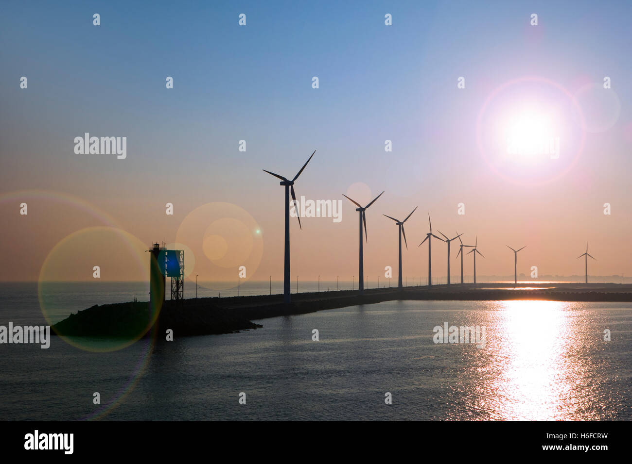 Wind turbines at windfarm on dam in the Zeebrugge / Zeebruges seaport, Belgium Stock Photo