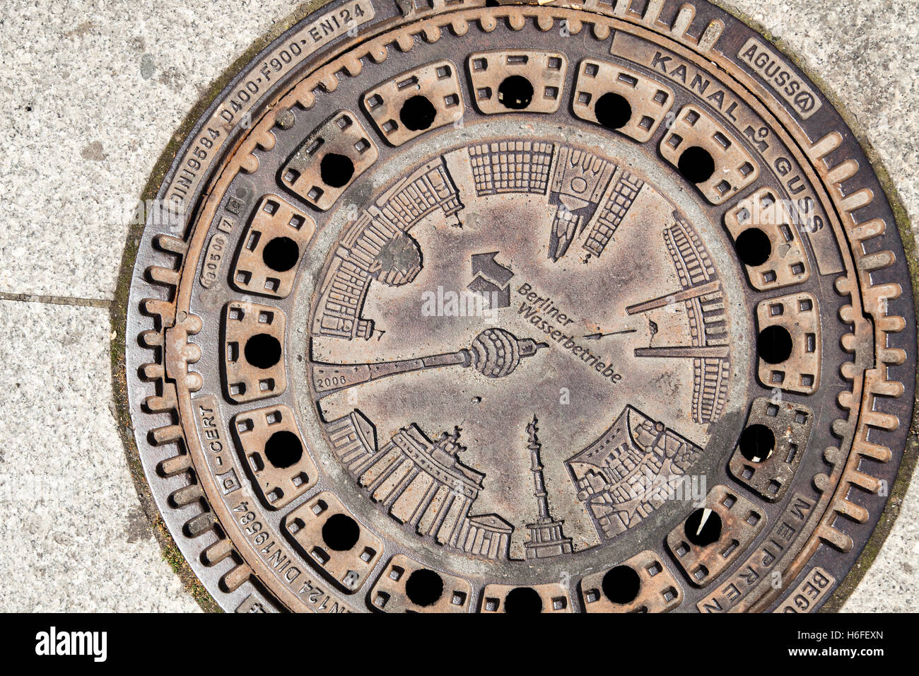 Berlin sewer cover in a street's pavement. Stock Photo