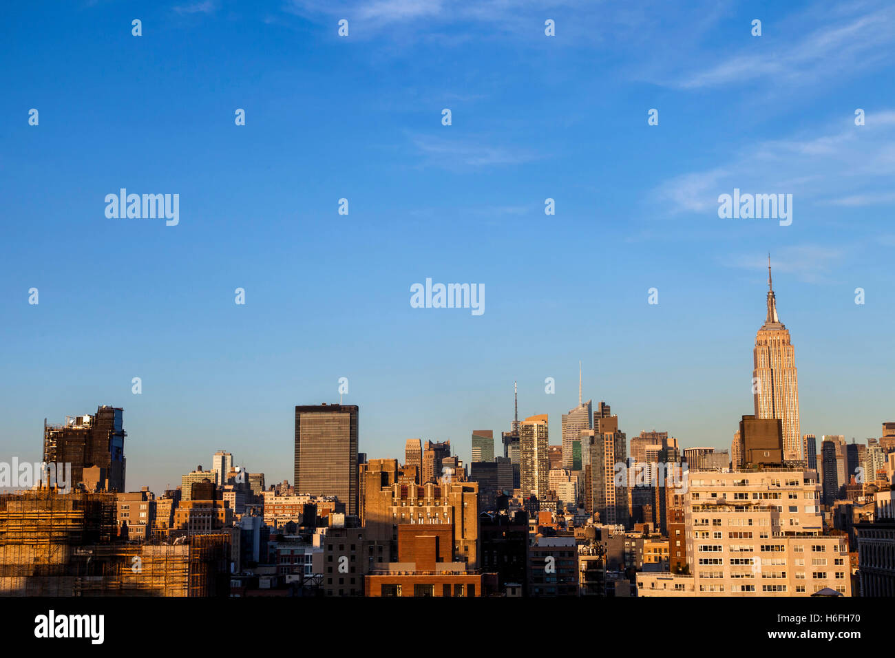 The tight cluster of skyscrapers habitating midtown Manhattan, as seen viewing north from the West Village. Stock Photo