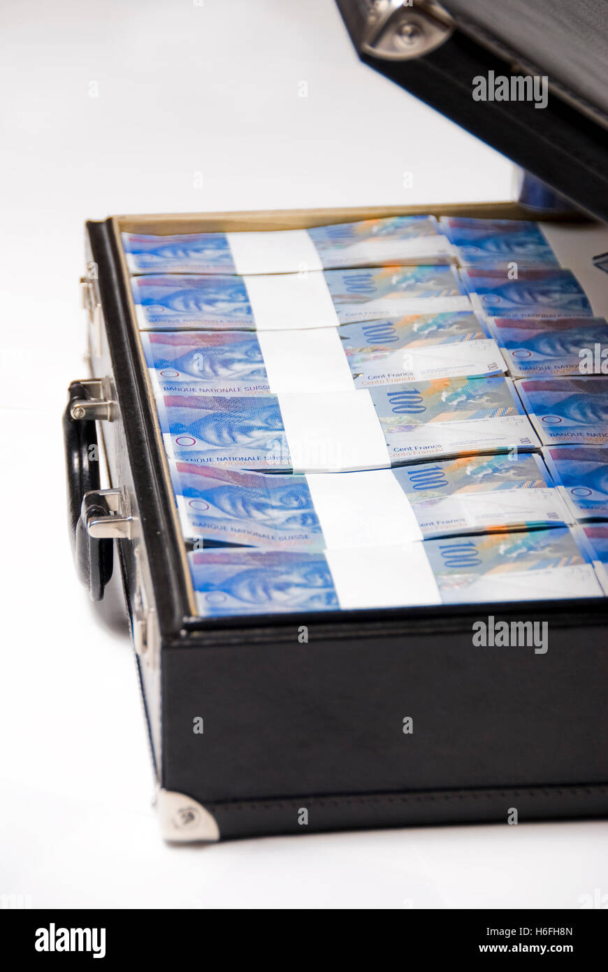 Briefcase full of Swiss francs, bills Stock Photo
