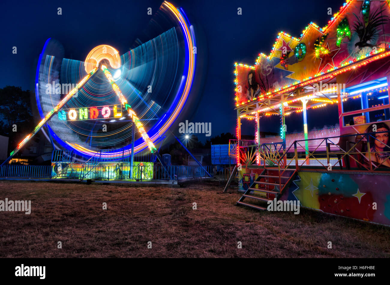 Gondola and train ride in funfair Stock Photo Alamy