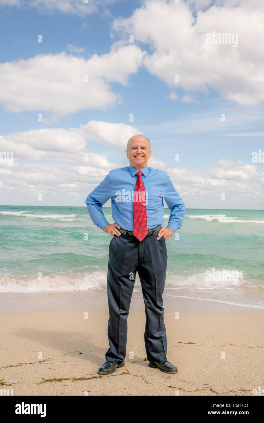 A businessman at the beach in Miami Beach, Florida. Stock Photo