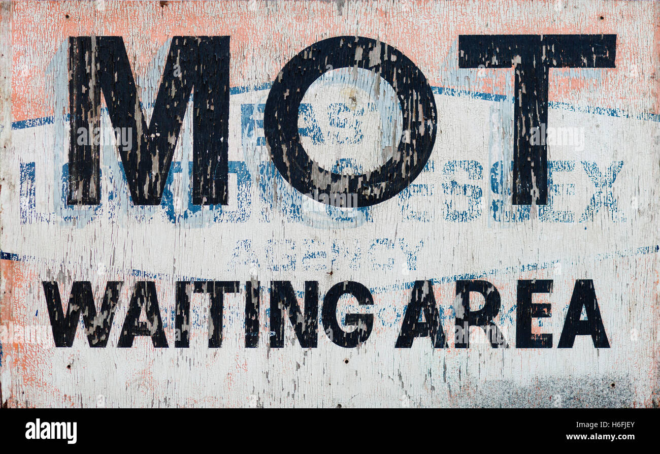 Old painted MOT Sign, painted on top of a previous sign.  As seen on Wheeler Dealers. UK Stock Photo