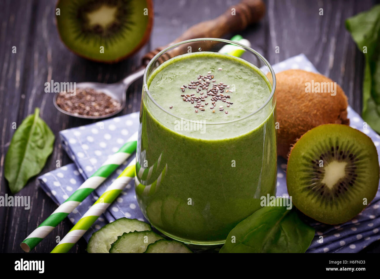 Fresh spinach smoothie with kiwi and cucumber. Selective focus Stock