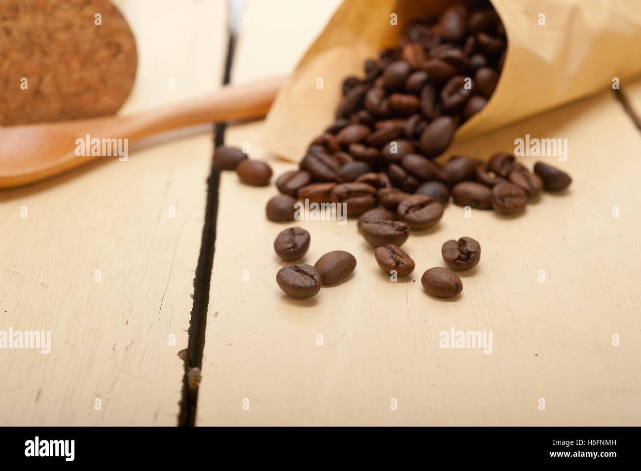 espresso coffee beans on a paper cone cornucopia over white background Stock Photo