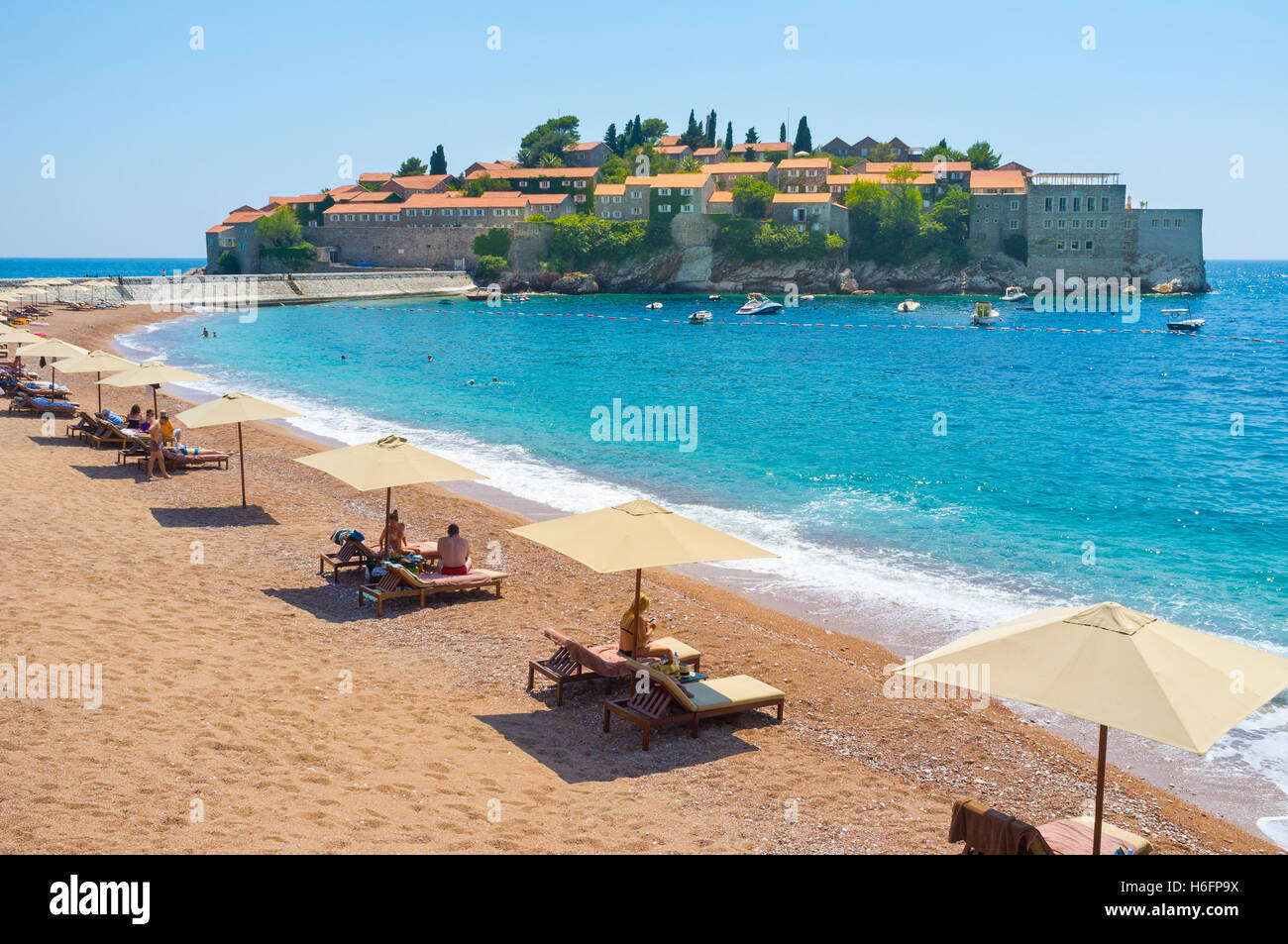The Sveti Stefan beach belongs to Aman Resorts hotel complex, located on the islet, Sveti Stefan Montenegro Stock Photo