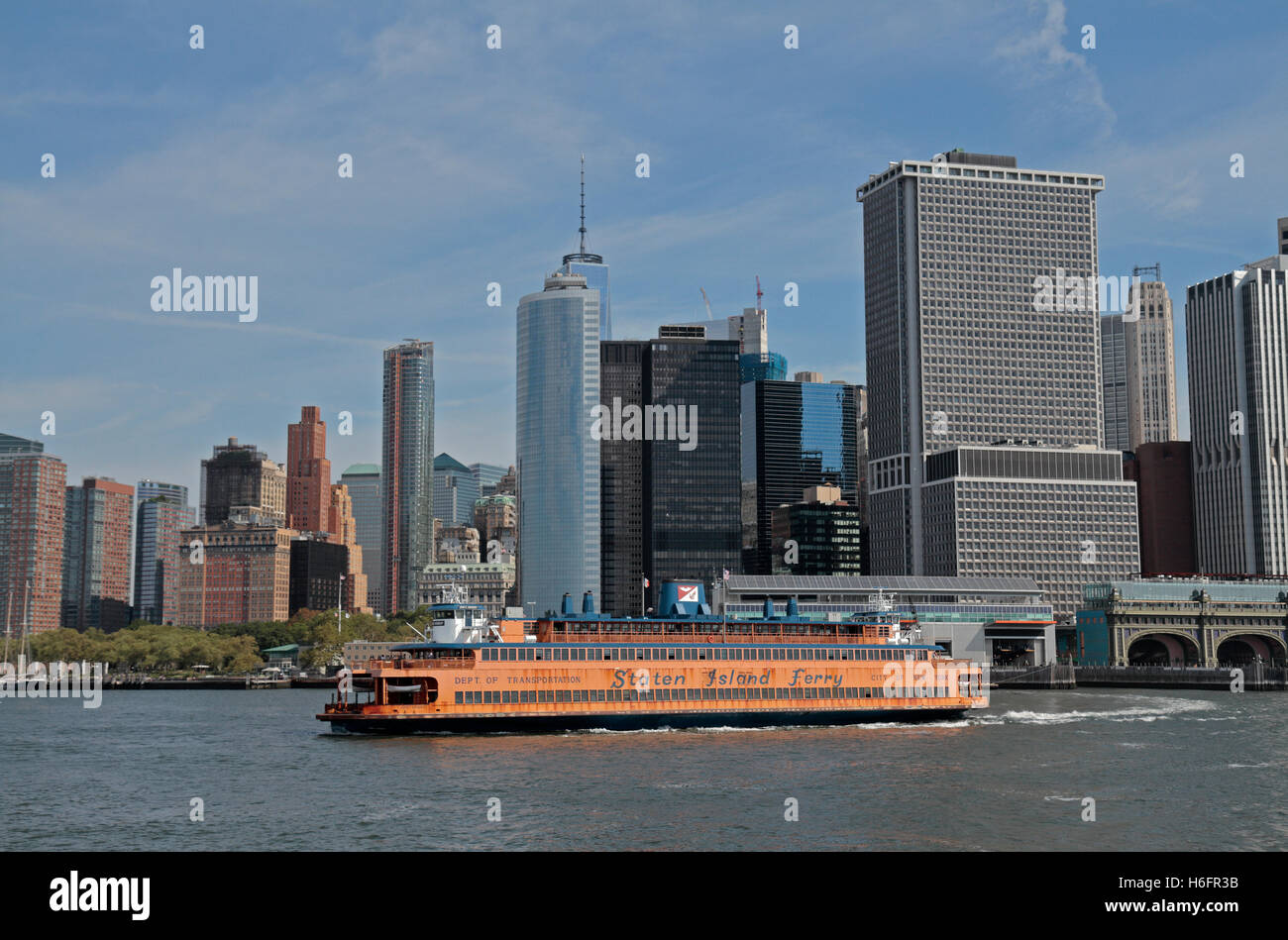 A Staten Island ferry departs the Manhattan terminal in front of the