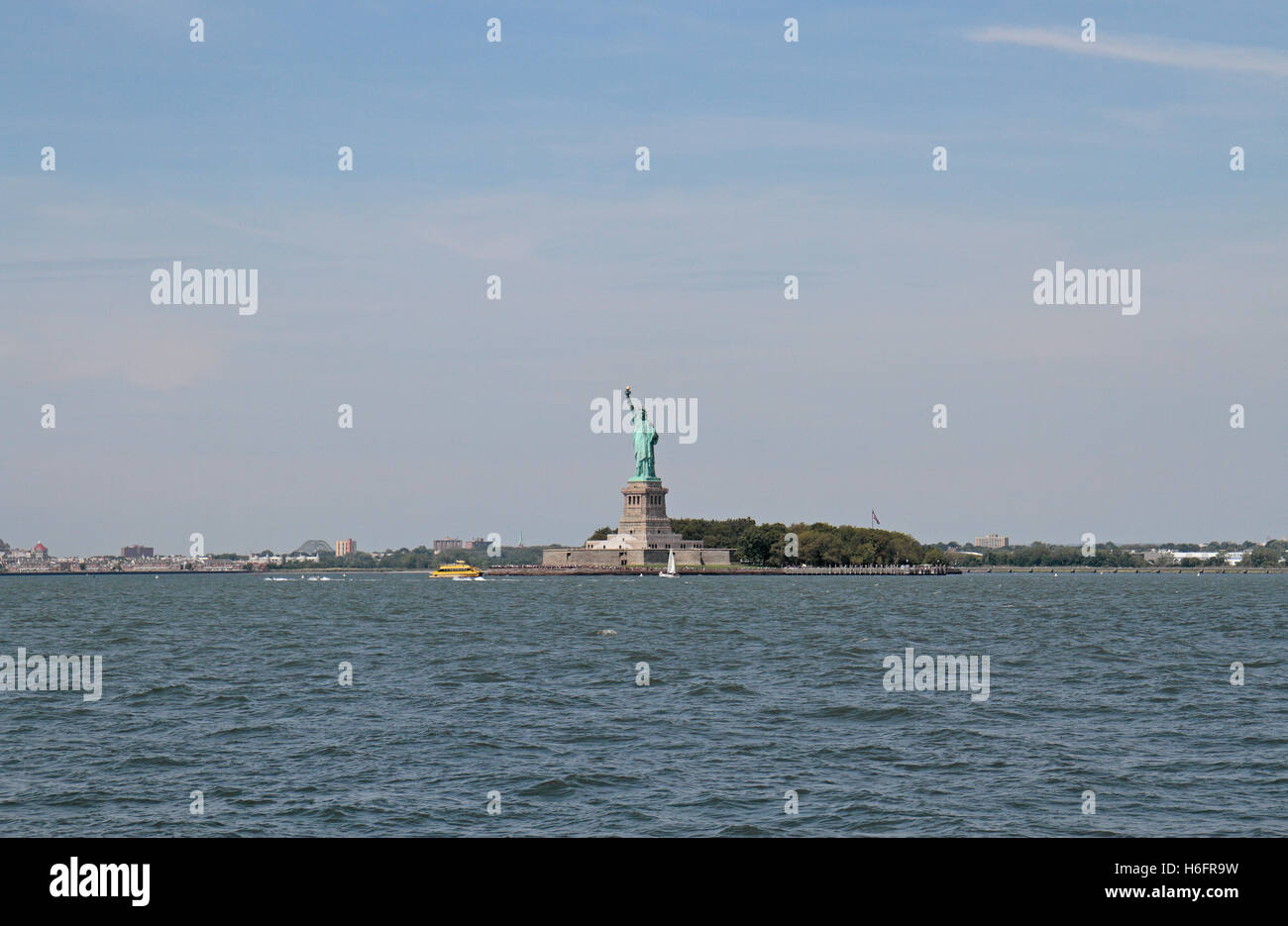 The Statue of Liberty in Upper New York Bay, New York, United States as viewed from Governors Island. Stock Photo