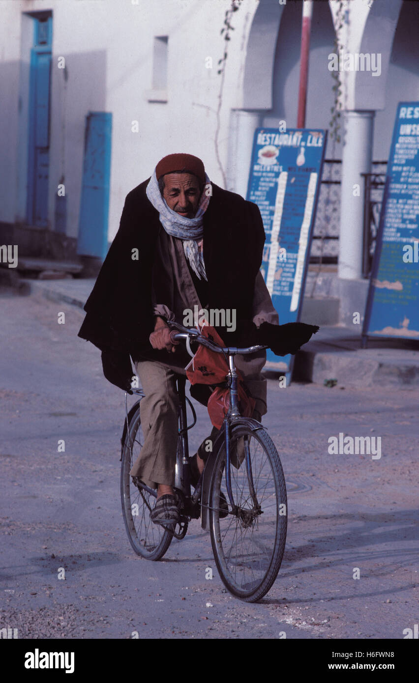 Tunisia, Jarbah Island, man on bicycle in Houmt Souk. Stock Photo