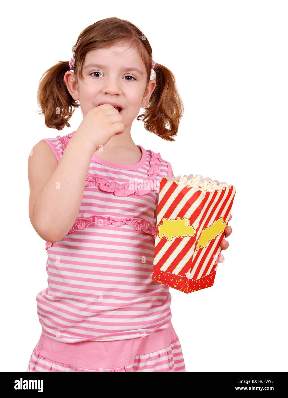 little girl eat popcorn on white Stock Photo